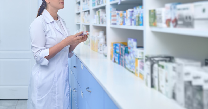 At work. Female pharmacist working in a drugstore